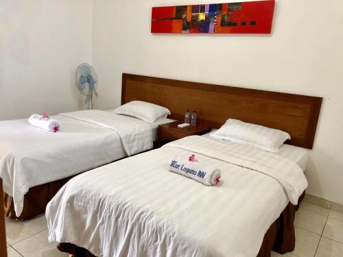 Kamar Standart 2p di Blue Laguna (Pusat Kota View Laut)