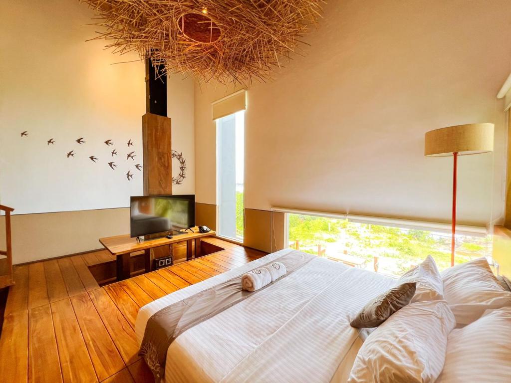 Kamar Grand Deluxe 4p di Halo Sustainable Hotel & Resort